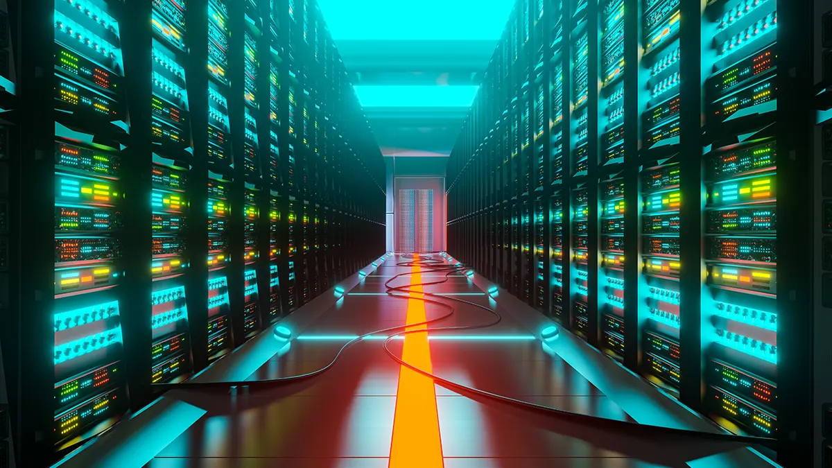 Pasillo de un centro de datos con racks de servidores iluminados, representando tecnología y almacenamiento digital